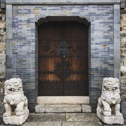 Statue against historic building