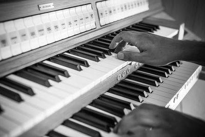 Low angle view of man playing piano