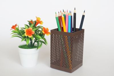 Close-up of multi colored pencils on white table