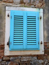 Closed blue window of building