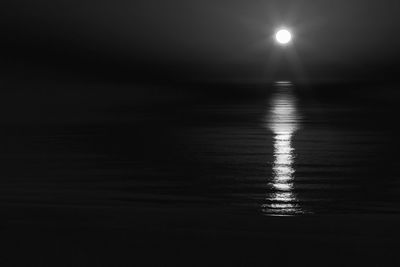 Scenic view of sea against sky at night