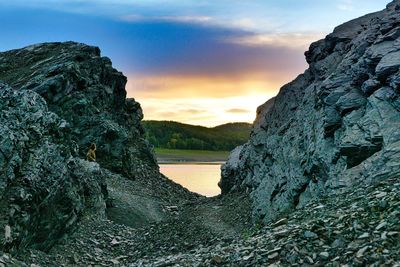 Rock formations against sky during sunset