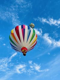 Low angle view of hot air balloons against sky