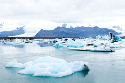 Scenic view of frozen lake against sky