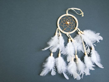 Close-up of decoration hanging against white background