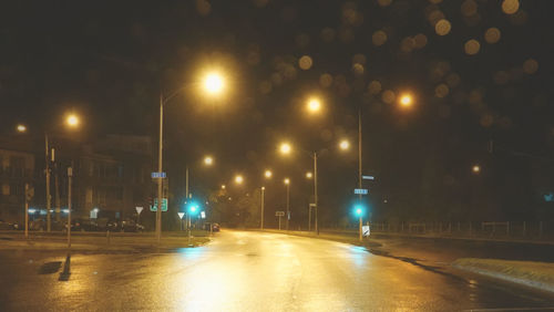 Illuminated street lights at night