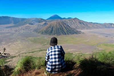 Rear view of man looking at mountain