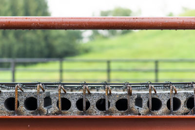 Close-up of wet railing during rainy season