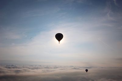 Low angle view of hot air balloons against sky during sunset