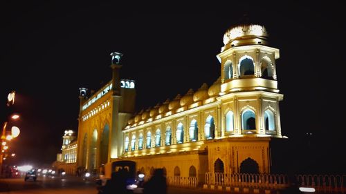 Low angle view of illuminated building at night