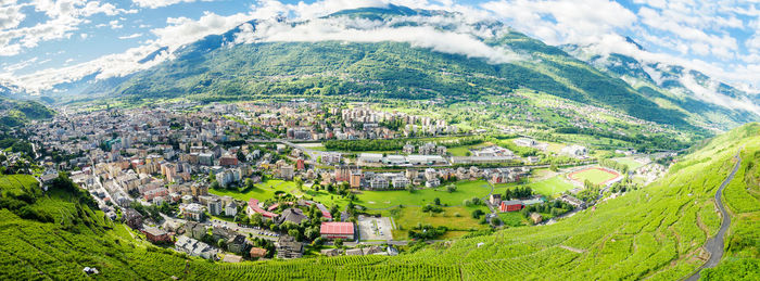 High angle view of trees and houses in village