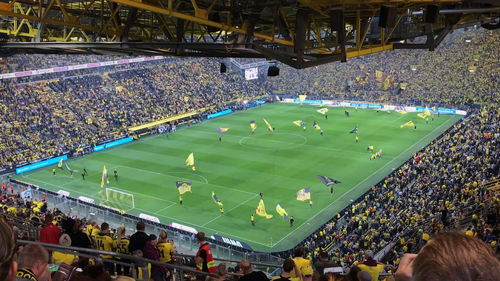 High angle view of people looking at soccer field