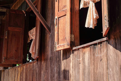 Low angle view of old wooden door of house