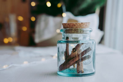 Jar of cinnamon in the kitchen. sweet spices in a jar. cinnamon sticks. aromatic spices.