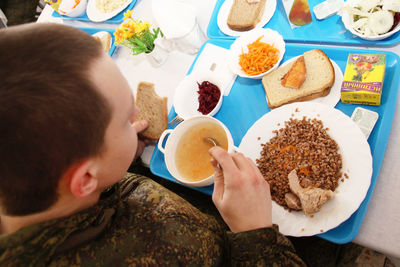 High angle view of man having breakfast