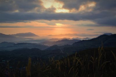 Scenic view of field against sky during sunset