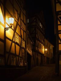 Low angle view of illuminated building at night