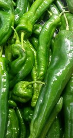 Full frame shot of green chili peppers for sale in market