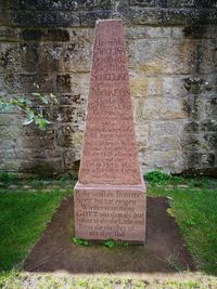 Close-up of text on stone wall