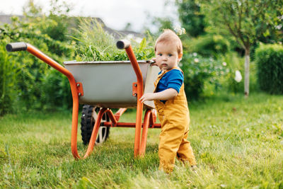 Full length of cute boy on land