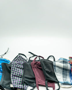Close-up of chairs on rack against gray background