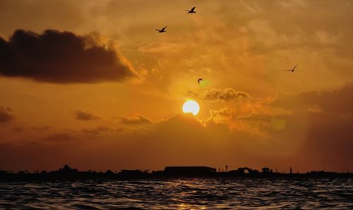 Scenic view of sea against sky during sunset