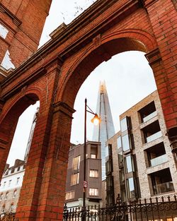 Low angle view of the shard through arches