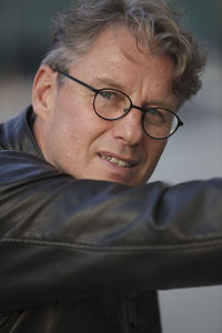 Portrait of man wearing black leather jacket