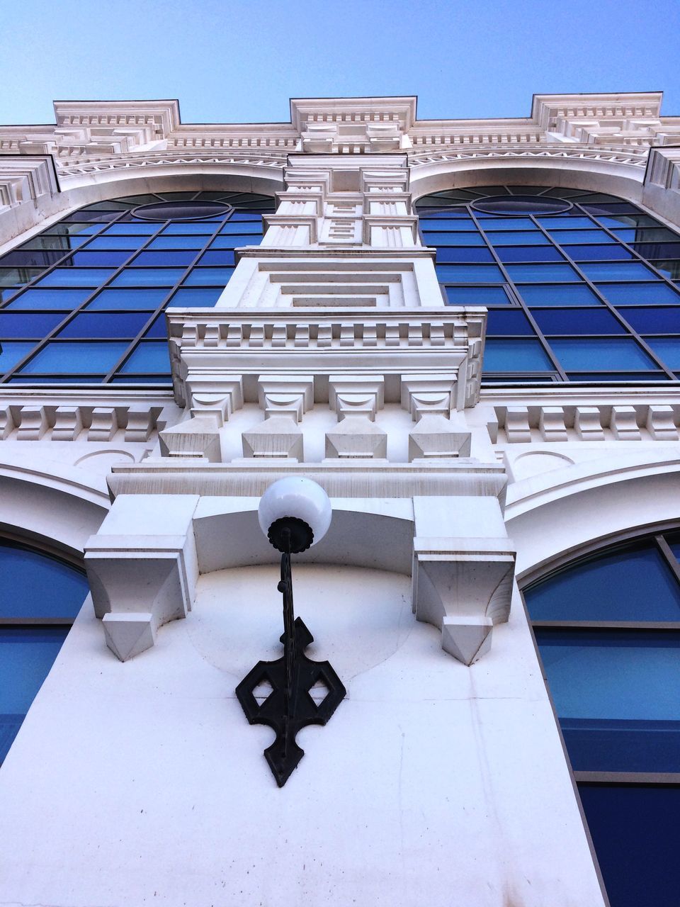 LOW ANGLE VIEW OF BUILDING AGAINST CLEAR BLUE SKY