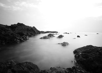 Scenic view of rock formations against sky