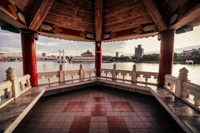 View of lake and buildings against sky