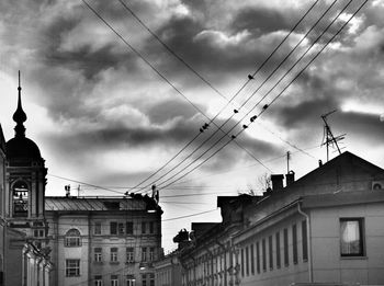 Low angle view of building against cloudy sky