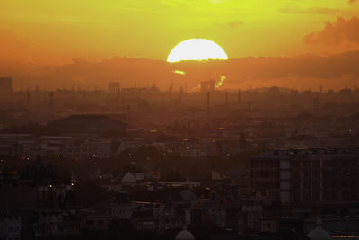 High angle view of townscape against sky during sunset