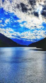 Scenic view of sea against blue sky