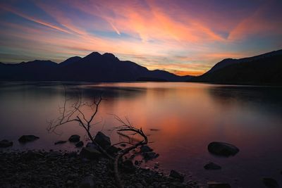 Scenic view of lake against sky during sunset