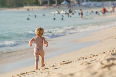 Full length of boy on beach