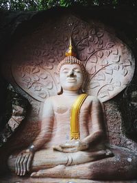 Statue of buddha outside building