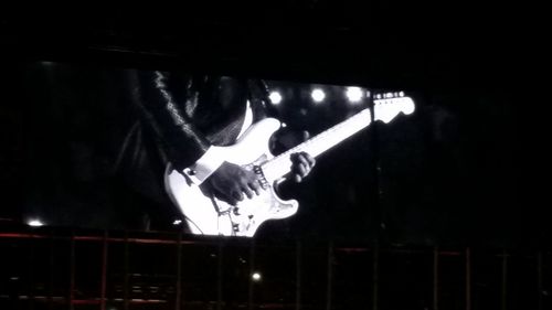 Man playing music concert at night