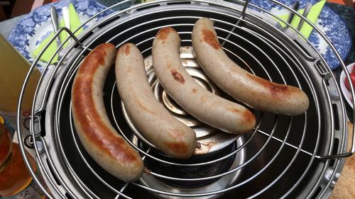 High angle view of meat on barbecue grill