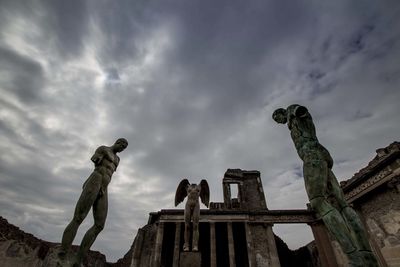 Low angle view of statue against sky