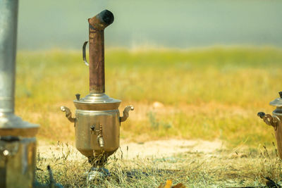 Close-up of metal on field