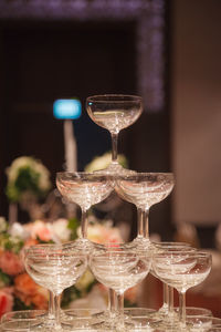 Close-up of wine glasses on table