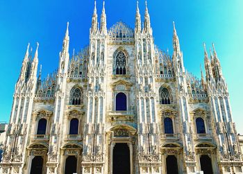 Low angle view of duomo di milano against sky