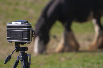 Close-up of camera on field