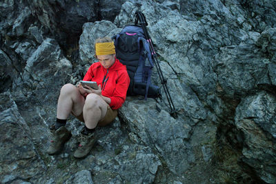 Man sitting on rock