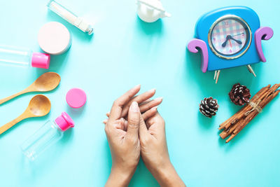 High angle view of woman hand on table