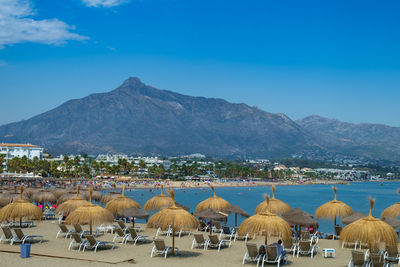 Panoramic view of beach against blue sky