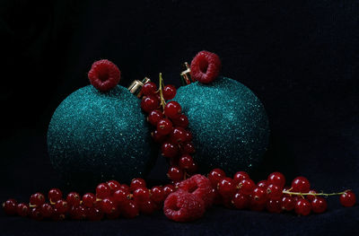 Close-up of strawberries on table against black background