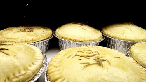 Close-up of cupcakes against black background