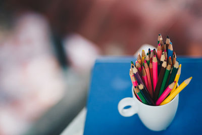 Close-up of multi colored pencils on table